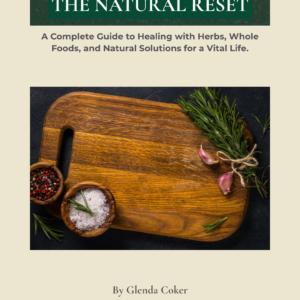 The Natural Reset guide cover by Glenda Coker featuring wooden cutting board and herbs.